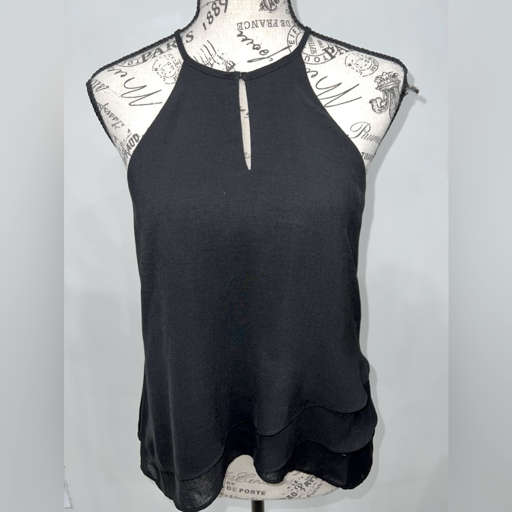 Black flowey blouse, sleeveless, key hole slit at top. With button, pre loved